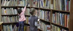 Girl reaches for a book